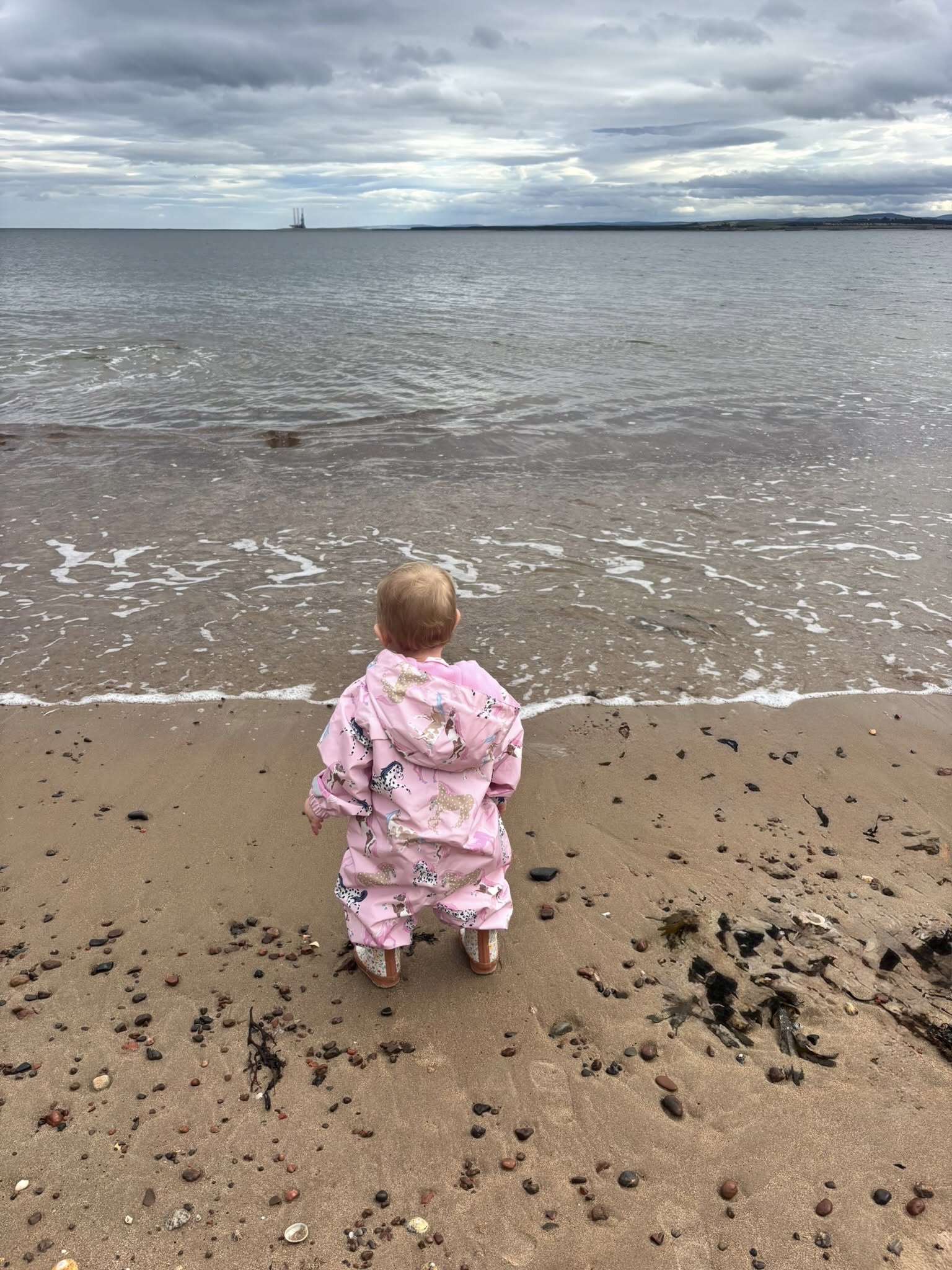 Child exploring the beach and outdoors